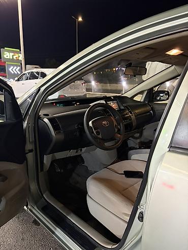nolyeddi şəkilləri: Toyota Prius (2-ci nəsil) hibrid hetçbek - Gümüş/boz rəngli kuzov, 5 — 7