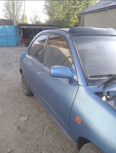 mazda demio автомобил: Mazda 121: 1994 г., 1.3 л, Механика, Бензин, Кабриолет