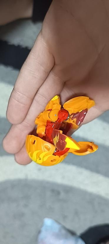Oyuncaq fiqurlar: Bakugan top fiqur – Pyrus fraksiyası. Oyuncağın kodu şəkildə görünür — 2