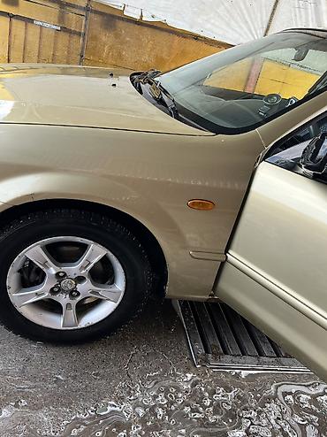 Mazda: Mazda 323: 2003 г., Бензин — 5