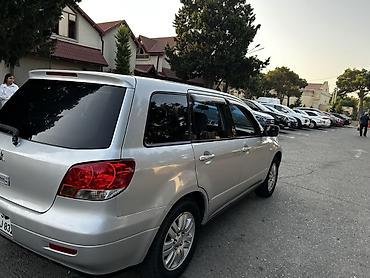 disk: Mitsubishi Airtrek (stansiya/wagon kuzov) – gümüşü rəng Texniki — 4