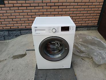 1000: Стиральная машина Beko с фронтальной загрузкой в рабочем состоянии — 1