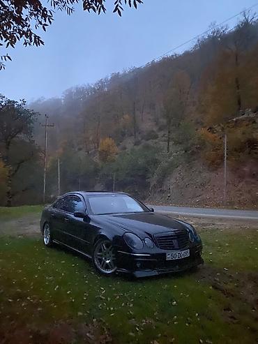 mercedes sekilleri: Mercedes-Benz E‑Class (W211) sedan – qara rəng, AMG üslublu eksteryer — 2