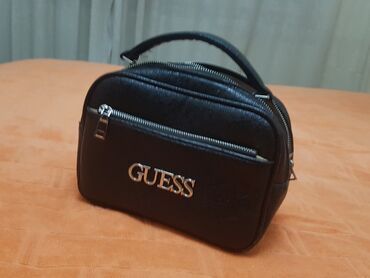 zenske jakne guess: Guess rucna odlicna torbica sa puno pregrada, nosena samo za posebne