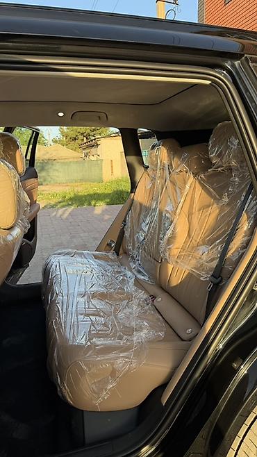 GAC: Черный кроссовер/внедорожник с просторным салоном и бежевой кожаной — 2