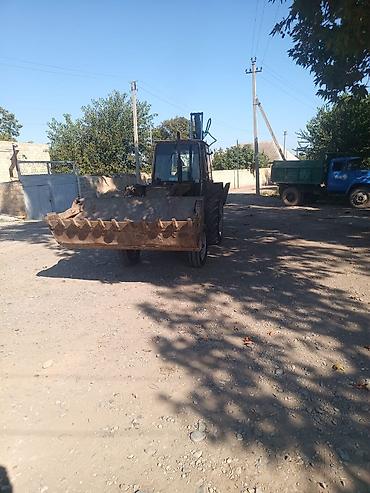 Kommersiya nəqliyyat vasitələri: Ekskavator-yükləyici traktor - Ön hissədə iri yükləmə kovası, arxa — 10