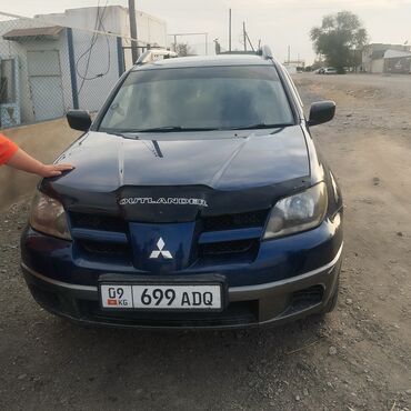 совместимые расходные материалы mitsubishi фотобумага: Автомобиль Mitsubishi Outlander синего цвета. Оснащен рейлингами на