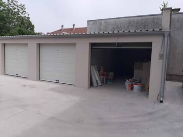 Garaže: Izdajem novu garazu 18m2 u centru grada u dvoristu novoizgradjene