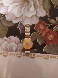 красивые платья на прокат в баку: İkirəngli klassik qol saatı - Korpus: qızılı tonlu dairəvi korpus