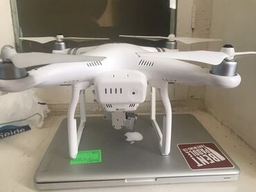 foto tərcümə: Dji phantom 3 Hd kameralı Uçs məsafəsi 500m 2 batrya Şarj cihazi üstdə