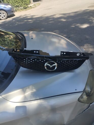 Решетки, облицовки: Решетка радиатора Mazda