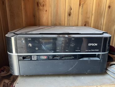 студийный микрофон: Многофункциональное устройство Epson Stylus Photo RX560 для печати
