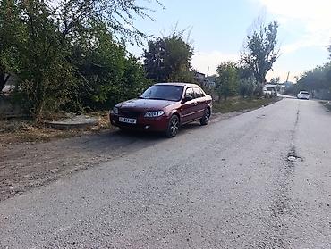 demio sport: Mazda 323: 2001 г., 1.8 л, Автомат, Бензин, Седан — 8