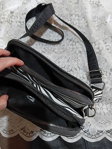 Suknje: Dve ženske mini suknje + torbica plus šorc - Crna mini suknja od — 10