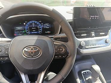 byd e2 2024: Toyota Corolla: 2023 г., 1.8 л, Вариатор, Гибрид, Седан — 2