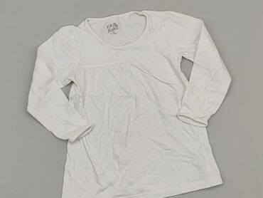 biała bluzka z falbanką dla dziewczynki: Bluzka, 7 lat, 116-122 cm, stan - Dobry