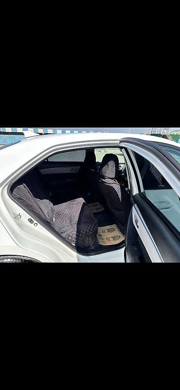corolla yan guzgu: Toyota Corolla, ağ rəng,sedan gövdə. I - Nömrə nişanı: 99-KY-573 — 8