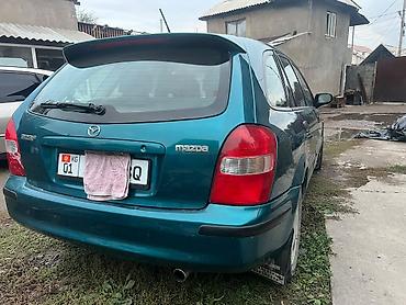 бампер виндом: Mazda Familia: 1999 г., 1.5 л, Автомат, Бензин, Седан — 6
