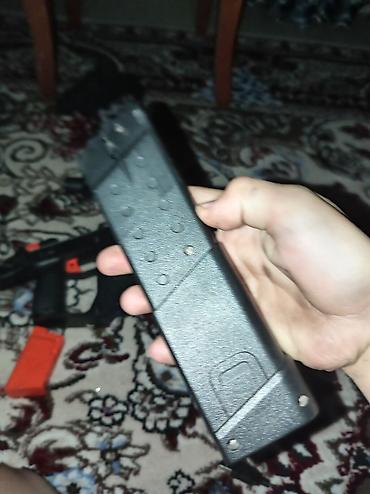 oyuncaqlar: Oyuncaq blaster – qara-narıncı rəng sxemi ilə Xüsusiyyətlər: - — 4