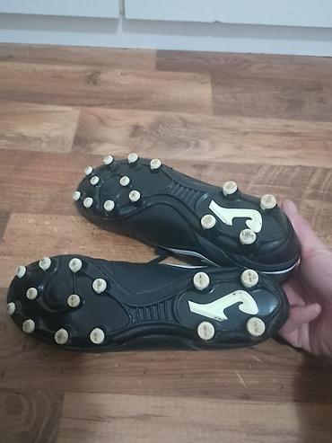 Kopačke: Kopačke Joma Aguila – crno‑bele - Model: Joma Aguila (logo i natpis — 11