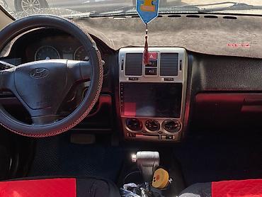 рул: Hyundai Getz: 2004 г., 1.4 л, Автомат, Бензин, Хетчбек — 5