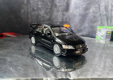 Avtomobil modelləri: Коллекционная модель Mitsubishi Lancer Evolution VII black 2002 — 5