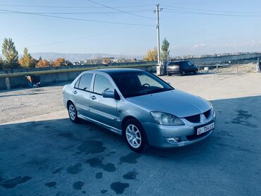 машина фит ош: Mitsubishi Lancer: 2004 г., 1.6 л, Механика, Бензин, Внедорожник