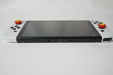 Nintendo Switch: U ponudi je Nintendo Switch OLED (čipovan). Memorija: 256 GB + 64 GB — 9