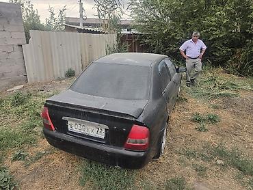 мазда фамили: Mazda Familia: 2003 г., Автомат, Седан — 4
