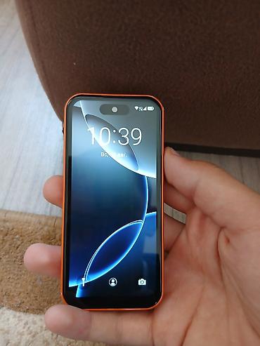 orange 5: Компактный кнопочно-сенсорный смартфон в ярком оранжевом корпусе с — 2