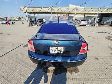 changan disk: Volkswagen Passat sedan. Avtomobil tünd göy rəngdədir və klassik — 6