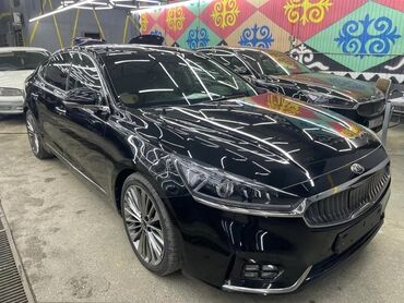 киа к5 к7: Черный седан Kia к7, представленный на фотографиях, имеет характерный