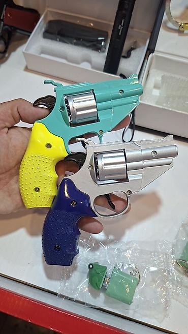 inkişaf etdirici oyuncaqlar: Oyuncaq Rəngli tapança Xüsusiyyətlər: - Revolver tipli - İstifadə — 1