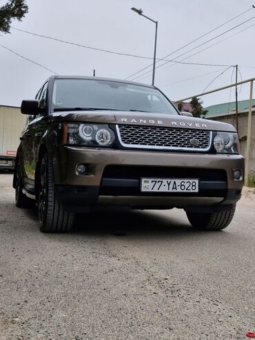 mitsubishi pajero dizel satilir: Qəhvəyi rəngdə olan Land Rover Range Rover Sport avtomobili. Salonda