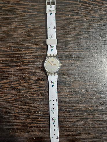 saat qol: Swatch qadın/qız qol saatı - Model: Swatch Originals (şəffaf — 1