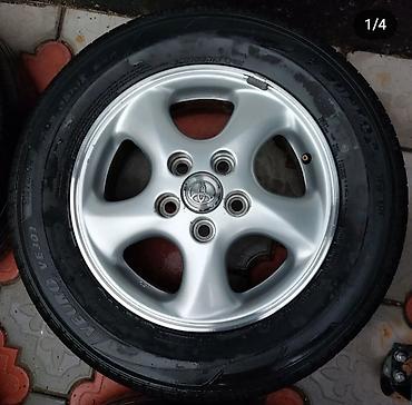 70 сом: Дөңгөлөктөр монтажда R 15, Колдонулган, Куйма — 2