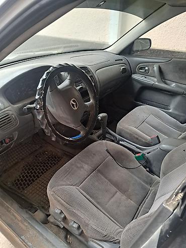 масквич машина: Mazda 323: 2000 г., 1.6 л, Автомат, Бензин, Седан — 4