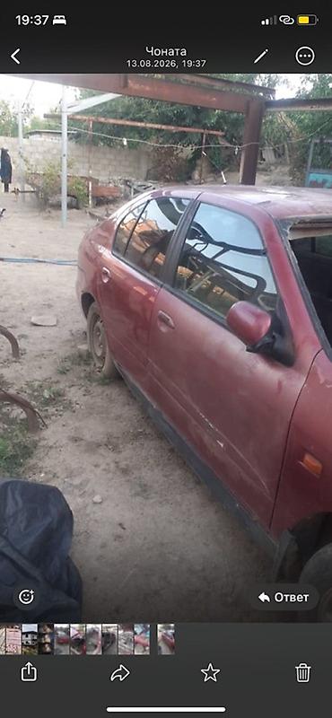 bye e2: Nissan Almera (седан), красный цвет, кузов P11. Описание: - — 4