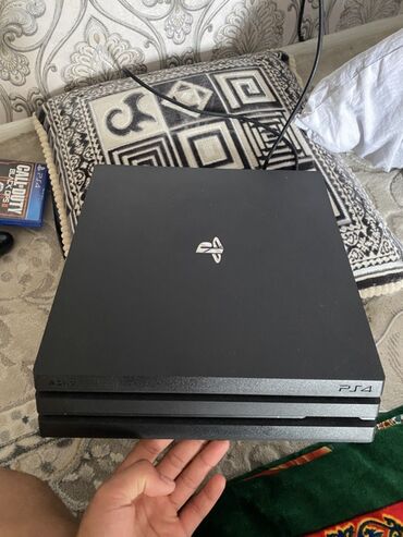 заказать сони плейстейшен 4: Игровая консоль PlayStation 4 Pro в черном корпусе. Мощная платформа