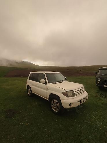 byd e9 1: Mitsubishi Pajero iO: 1999 г., 1.8 л, Автомат, Бензин, Внедорожник — 3