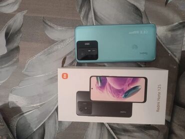 ekran iphone 11 pro: Xiaomi Redmi Note 12S smartfonu açıq mavi rəngdədir. Arxa tərəfində üç