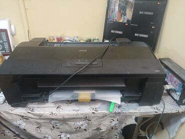 купить эпл ноутбук: Qara rəngdə olan Epson markalı printer. Ofis və ya evdə istifadə üçün
