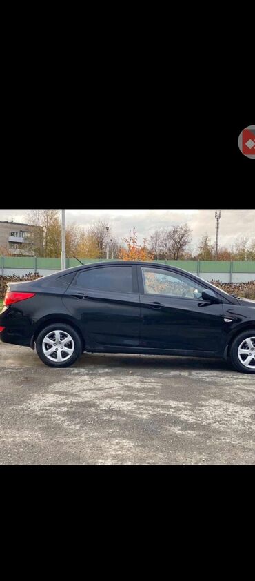 киа салярис: Hyundai Solaris седан, черный цвет кузова. Основные особенности: -