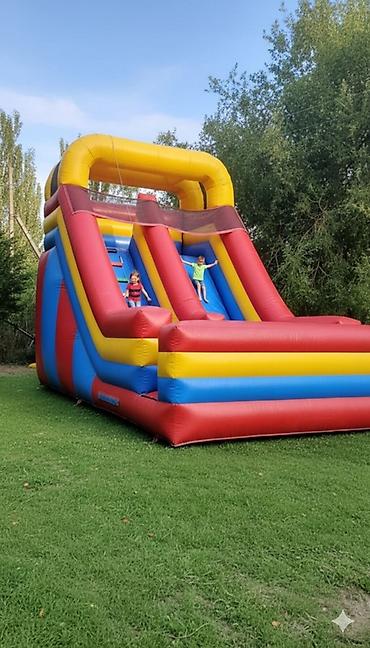 Детские аттракционы: Продаю или сдам в аренду батут - горка .размеры: высота - 4,5 м.длина — 1