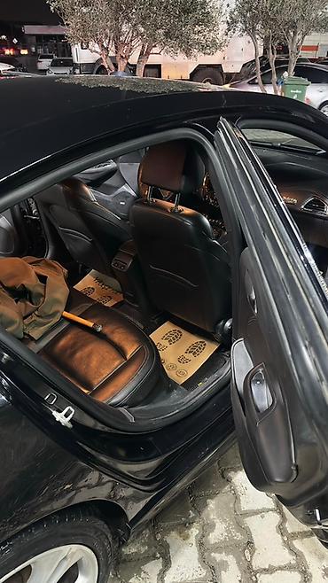elektrikli maşınlar: Chevrolet Cruze Sedan – qara rəng, aerodinamik kuzov və LED ön/arka — 3