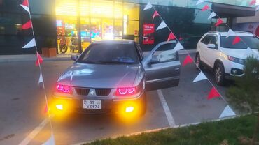 Iran Khodro: Samand sedan – benzinli, ön ötürücülü. Gümüşü rəng.nömrə nişanı — 1