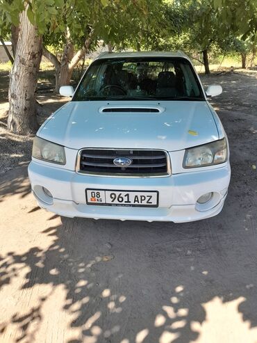диск субару форестер: Белый кроссовер Subaru Forester, оснащенный люком на крыше. Автомобиль