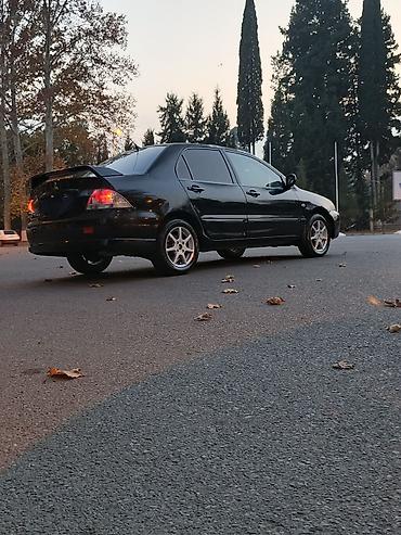 w202 qapı: Mitsubishi Lancer: 1.6 l | 2005 il 290000 km Sedan — 3