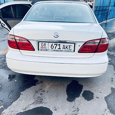 diska 13: Nissan Sunny: 2002 г., Автомат, Бензин, Седан — 7