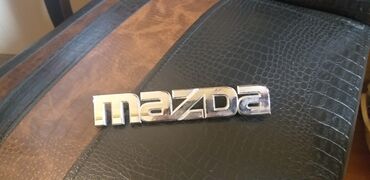 relif maz qiymeti: Mazda (emblemi)
20 azn